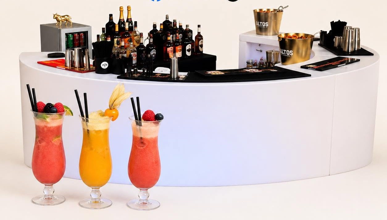 The ALL 4 BAR curved white portable bar with three fruit cocktails in front